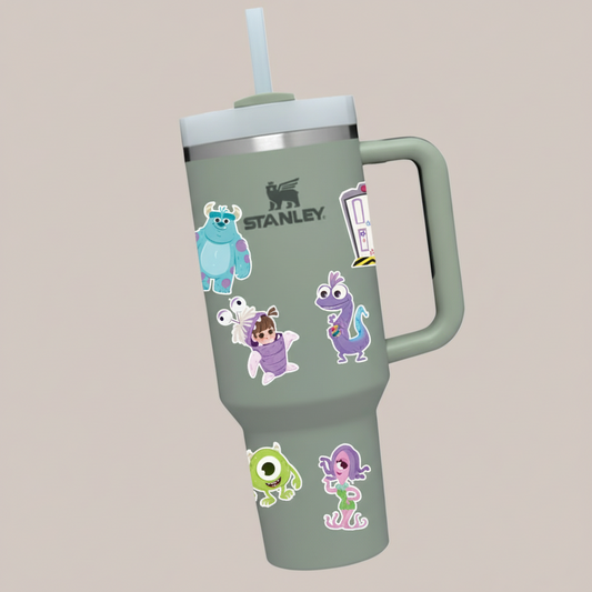 Stanley tumbler with Monsters, Inc. character stickers on a colorful background