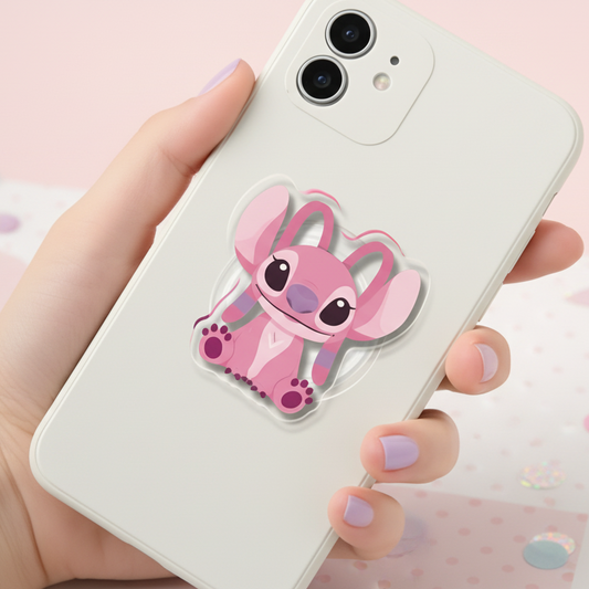 Pink cartoon character on a phone case held by a hand