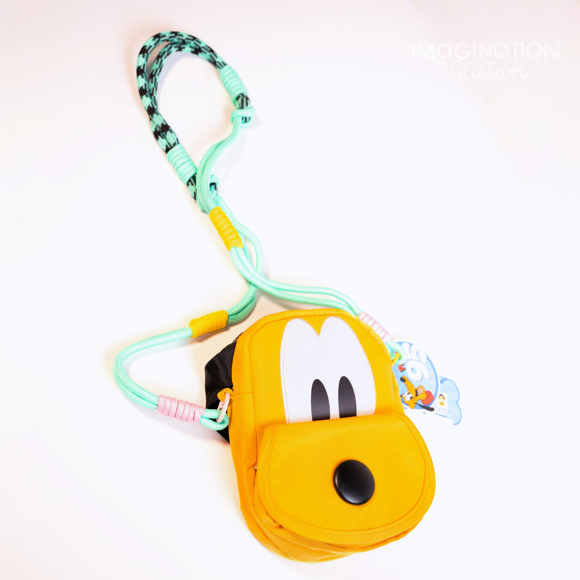 Pluto shaped Disney dog crossbody bag front view showing face and ears