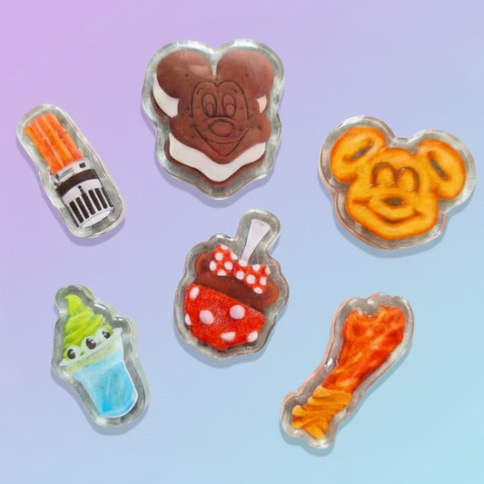 Set of colorful character-shaped cookies on a gradient blue background