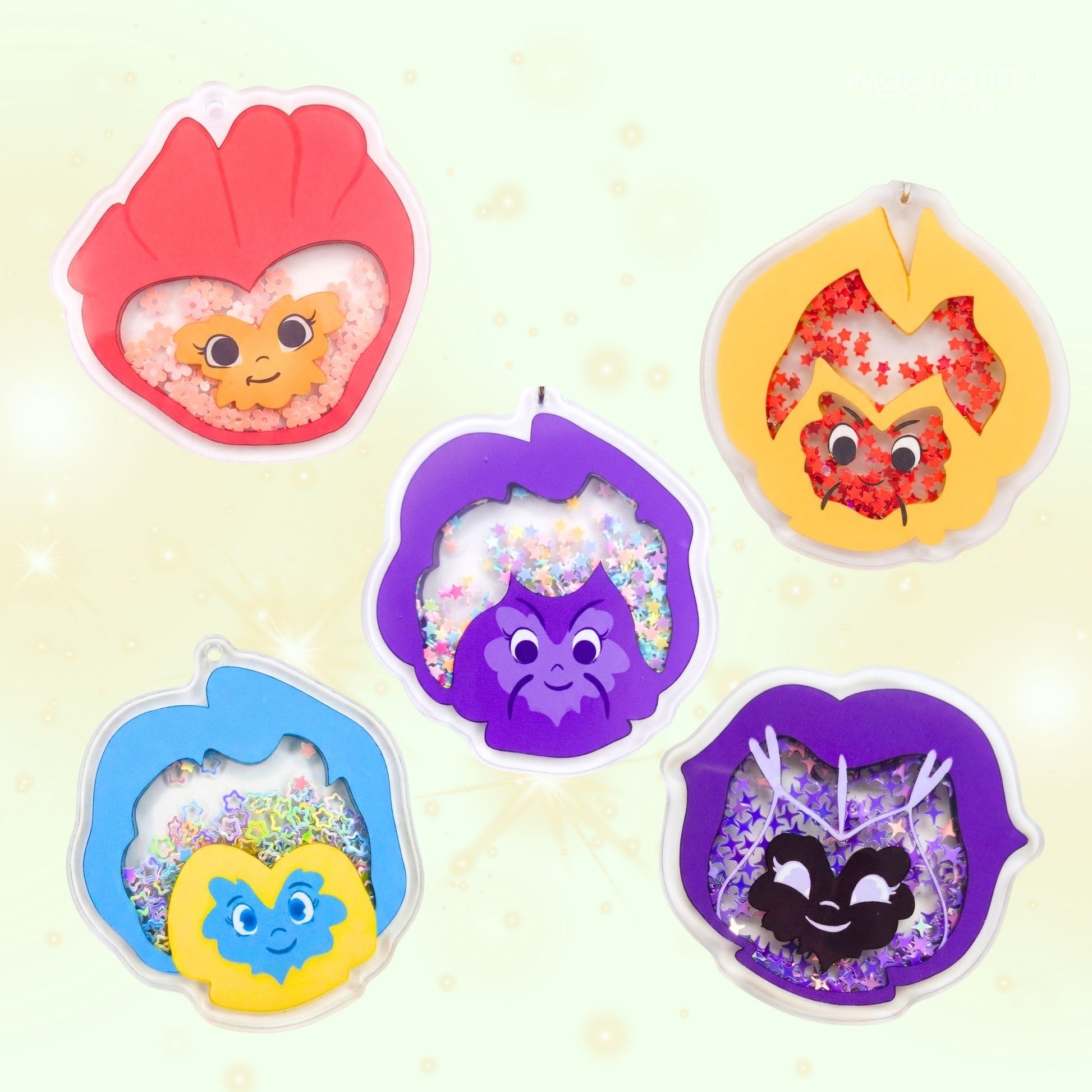 Five colorful character-themed candles on a light background