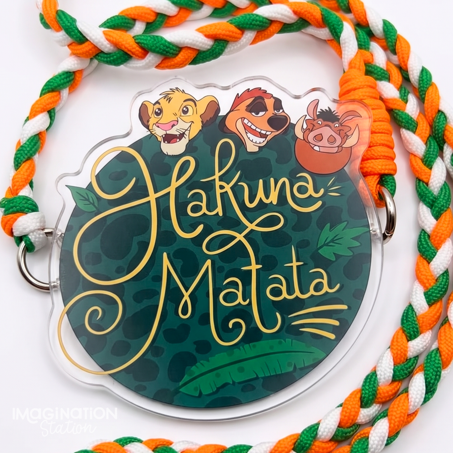 Hakuna Matata trio acrylic phone charm front view on phone case showing Simba Timon and Pumbaa jungle illustration