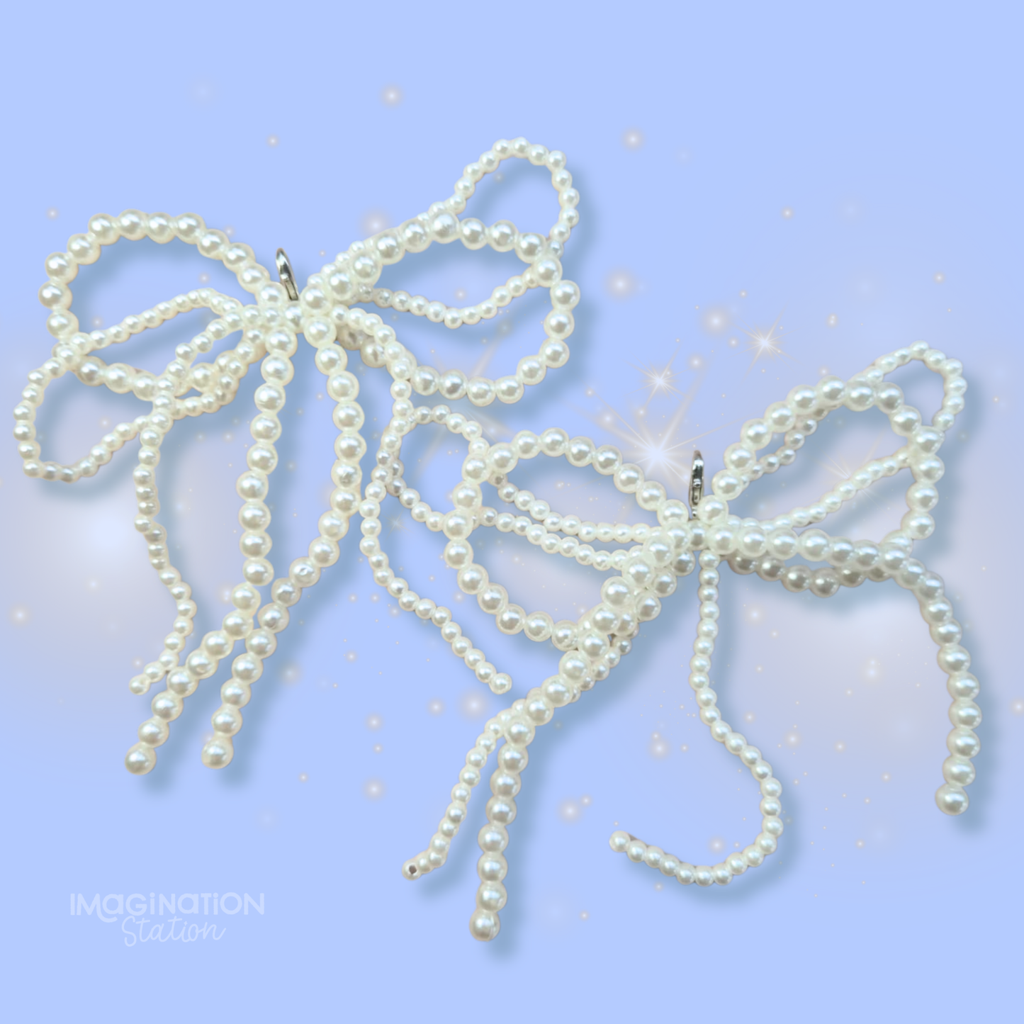 Pearl bow hair accessories on a light blue background