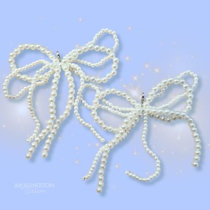 Pearl bow hair accessories on a light blue background