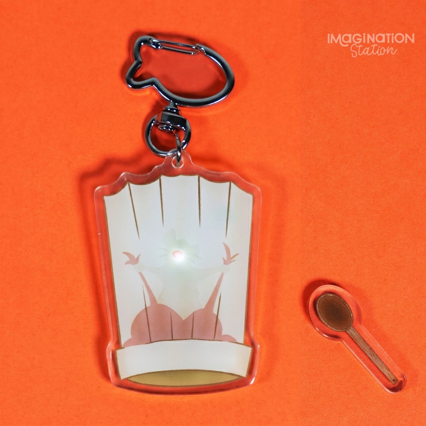 Ratatouille Remy light-up keychain front view showing chef hat silhouette