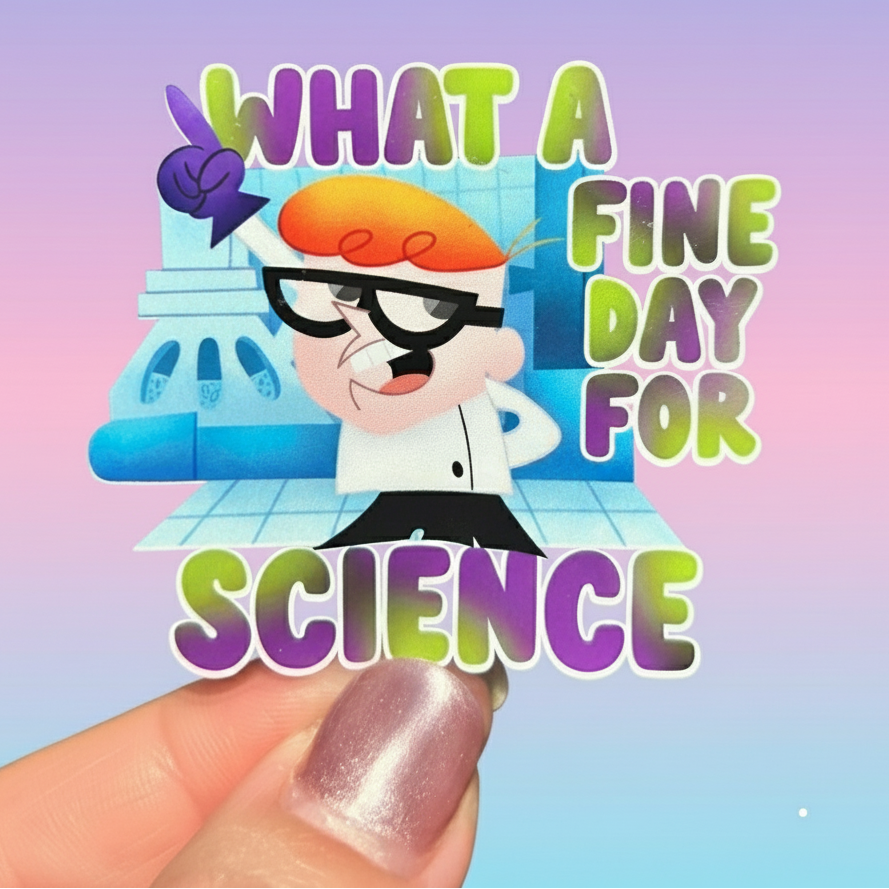 Sticker with cartoon character and text 'What a fine day for science' held against a green leafy background