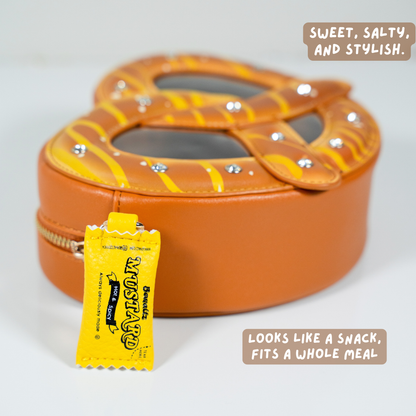 Pretzel novelty bag side view showing golden brown twisted design