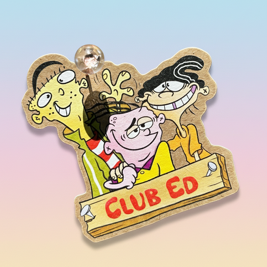 Cartoon character sticker with 'CLUB ED' text on a textured brown background