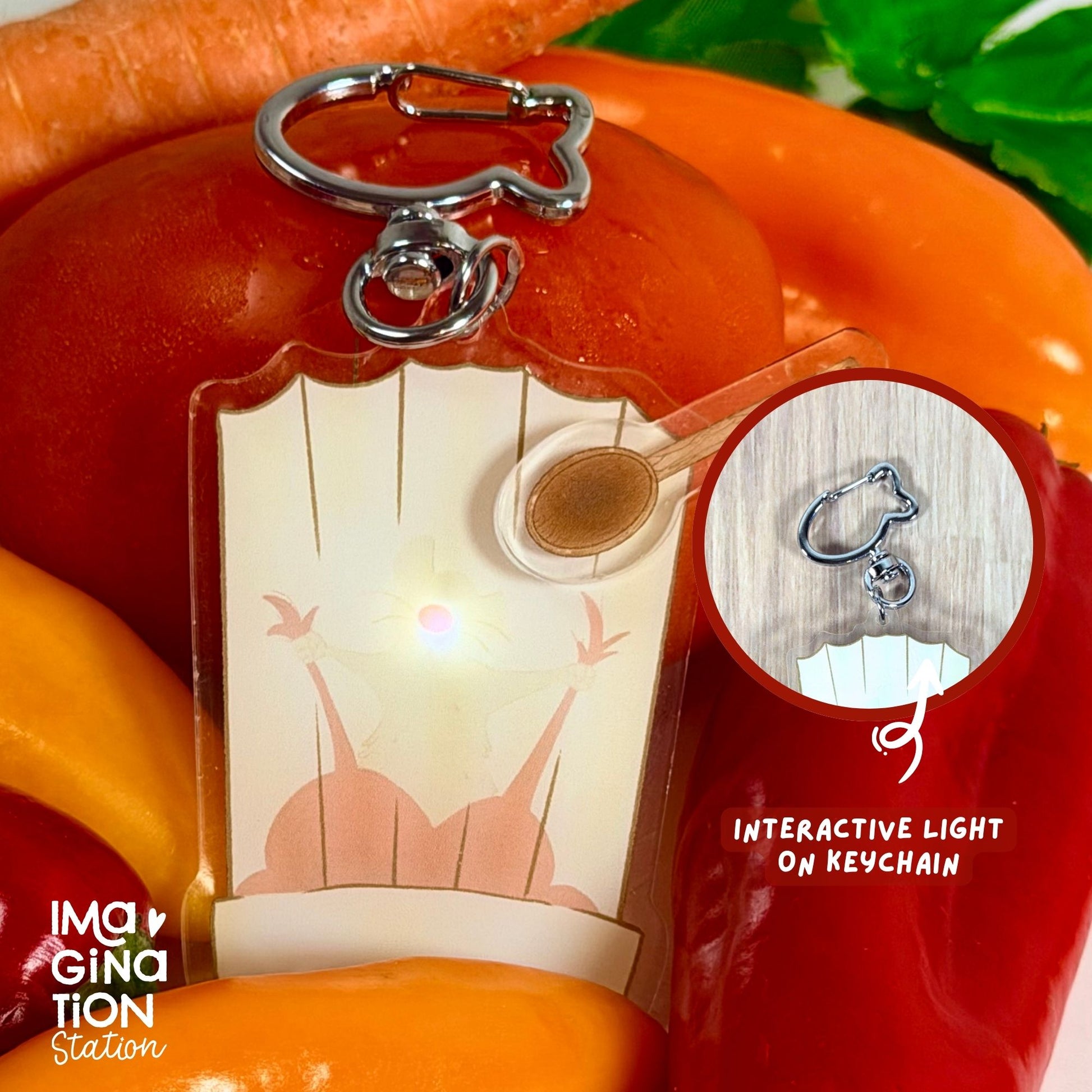 Remy Ratatouille acrylic keychain surrounded by fresh vegetables lifestyle shot