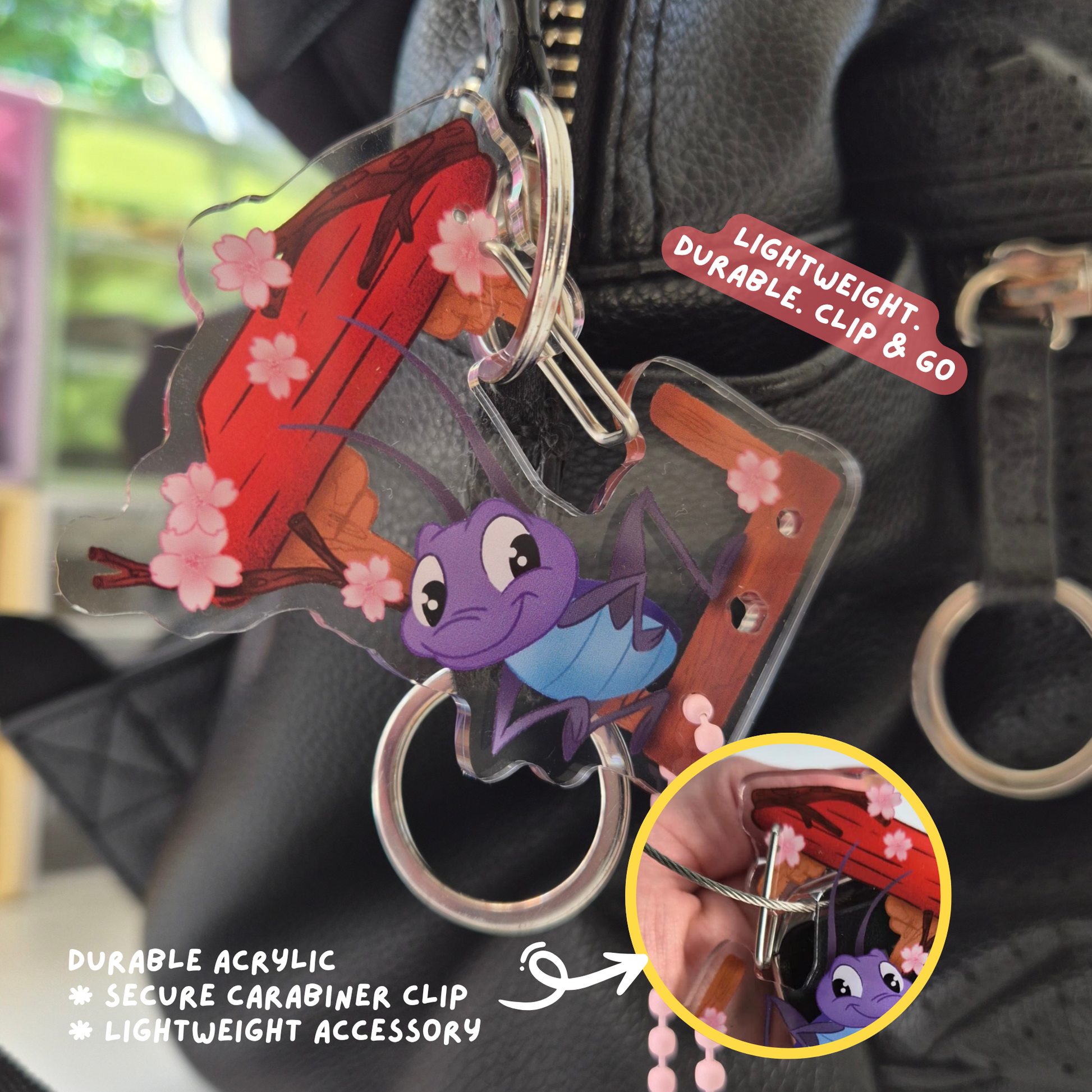 Keychain with cartoon characters attached to a bag, featuring text on durability and design.