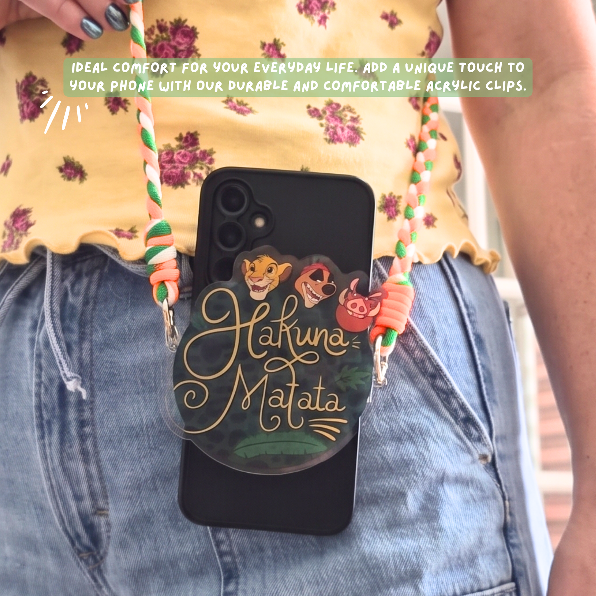 Hakuna Matata phone charm close up showing jungle leopard print background and gold script lettering