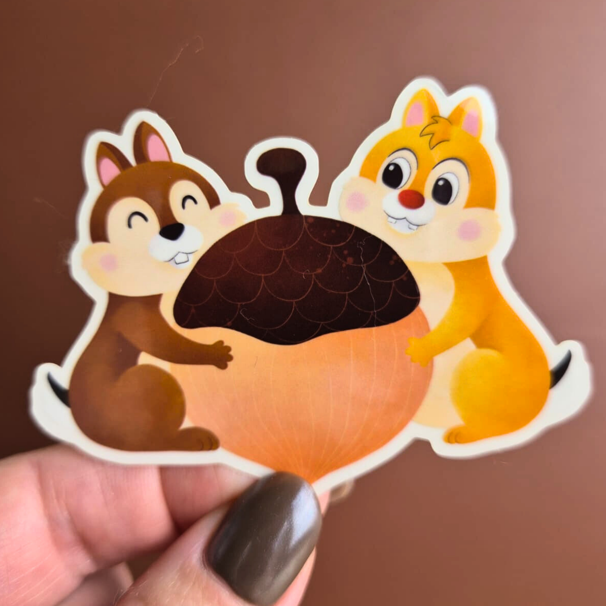 Chip and Dale Disney sticker held by hand – clear glossy waterproof chipmunk vinyl