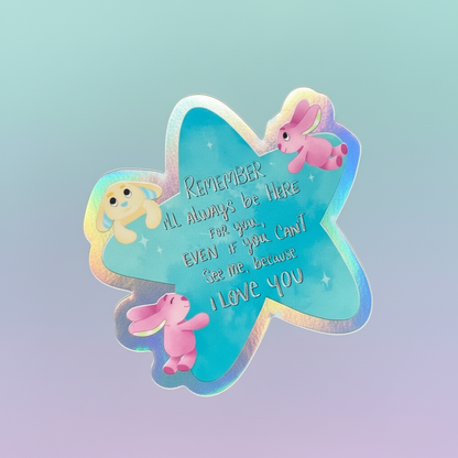Butterfly-shaped sticker with cartoon characters and text held against a green leafy background