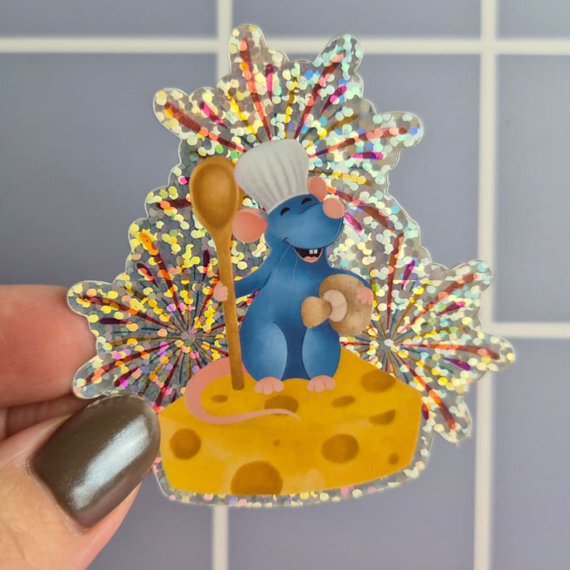 Ratatouille Remy sticker held by hand – glitter glossy Disney Pixar chef waterproof vinyl