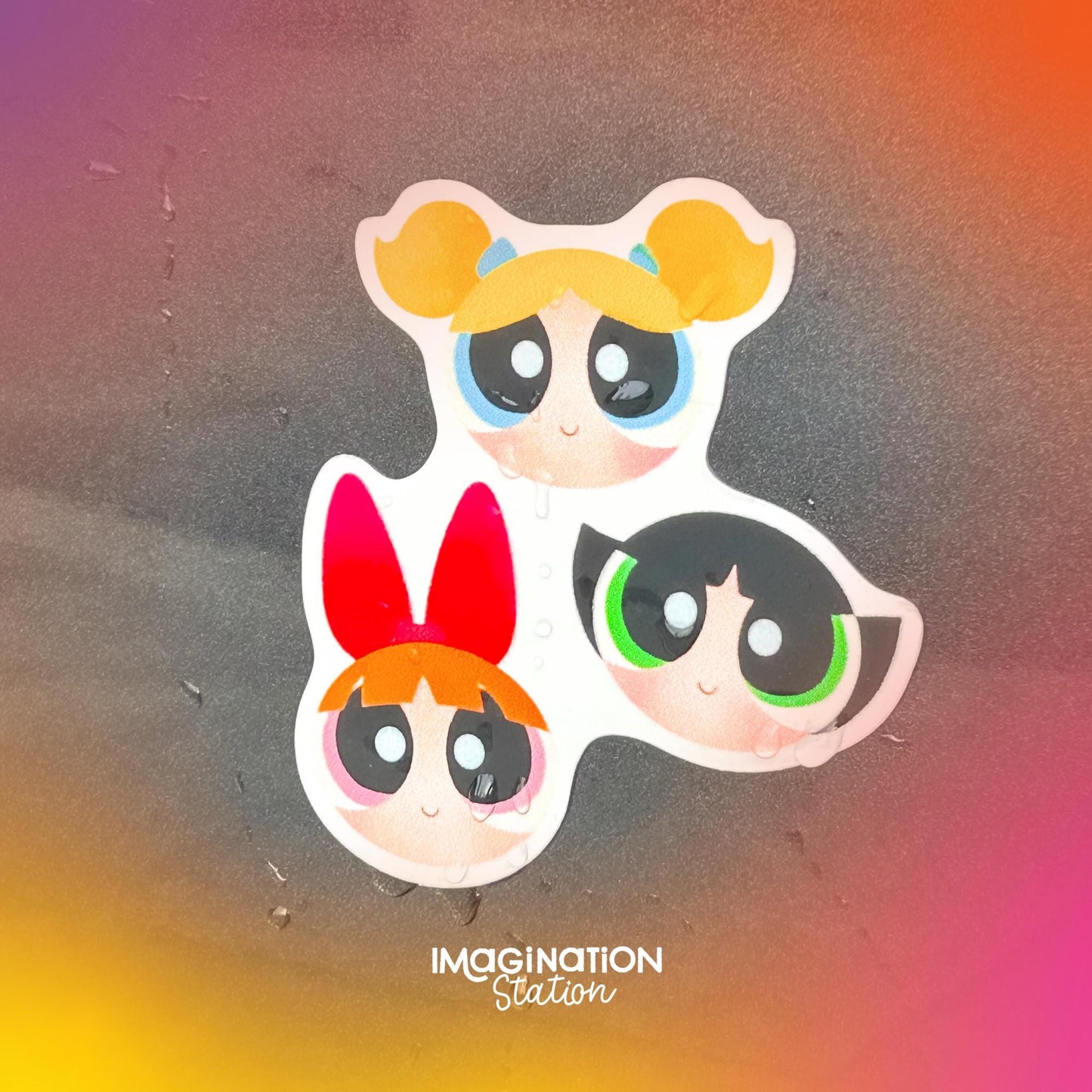 Three cartoon characters with colorful hair on a gradient background with 'Imagination Station' text.