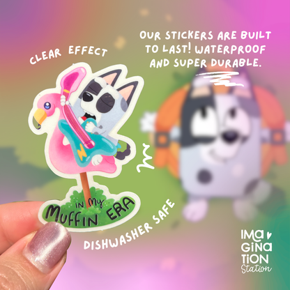 In My Muffin Era Bluey sticker held by hand – clear glossy waterproof Disney vinyl decal