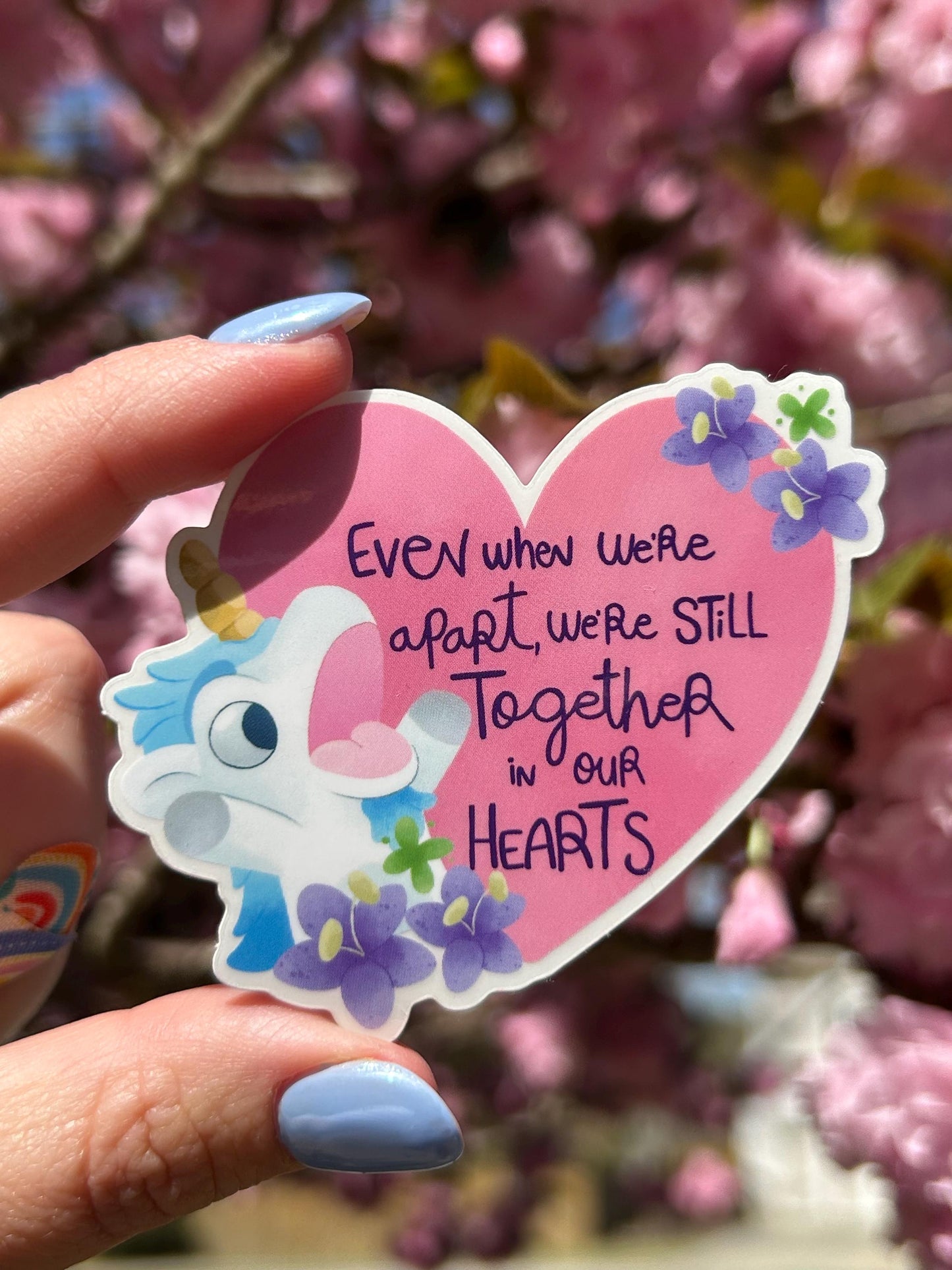 Bluey Unicorse sticker held by hand – I AM UNICORSE clear glossy Disney vinyl decal