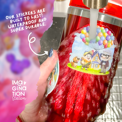Red bottle with a colorful sticker featuring cartoon characters, held by a hand with a blurred background.