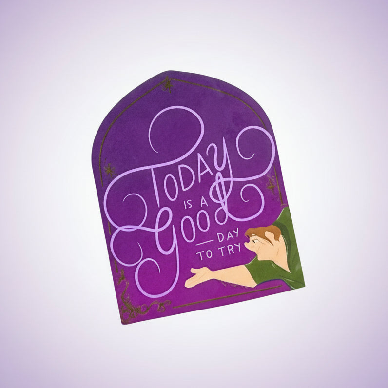 Purple sticker with text 'Today is a good day to try' on a blurred background