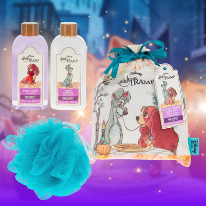 Disney Lady &amp; the Tramp bath and body set with bottles, bag, and loofah on a magical background.