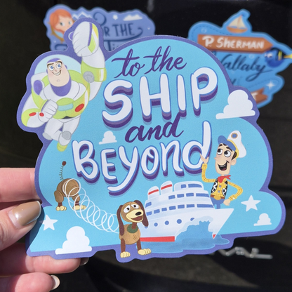 A close-up of a hand holding a collection of four custom die-cut Toy Story-themed magnets for a Disney Cruise stateroom door. The colorful magnets feature Buzz Lightyear, Woody, Slinky Dog, and a cruise ship, with the exact text: "To the SHIP and Beyond!". Perfect for cabin decoration.