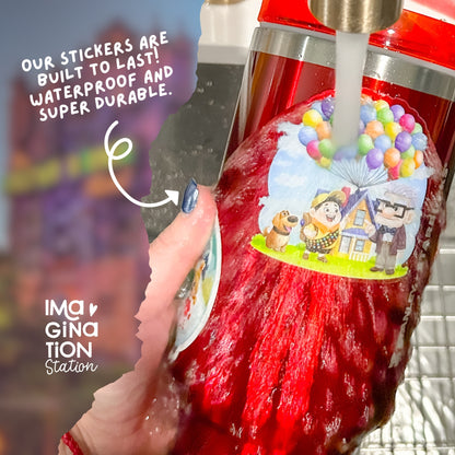Red bottle with a colorful sticker featuring cartoon characters, held by a hand with a blurred background.