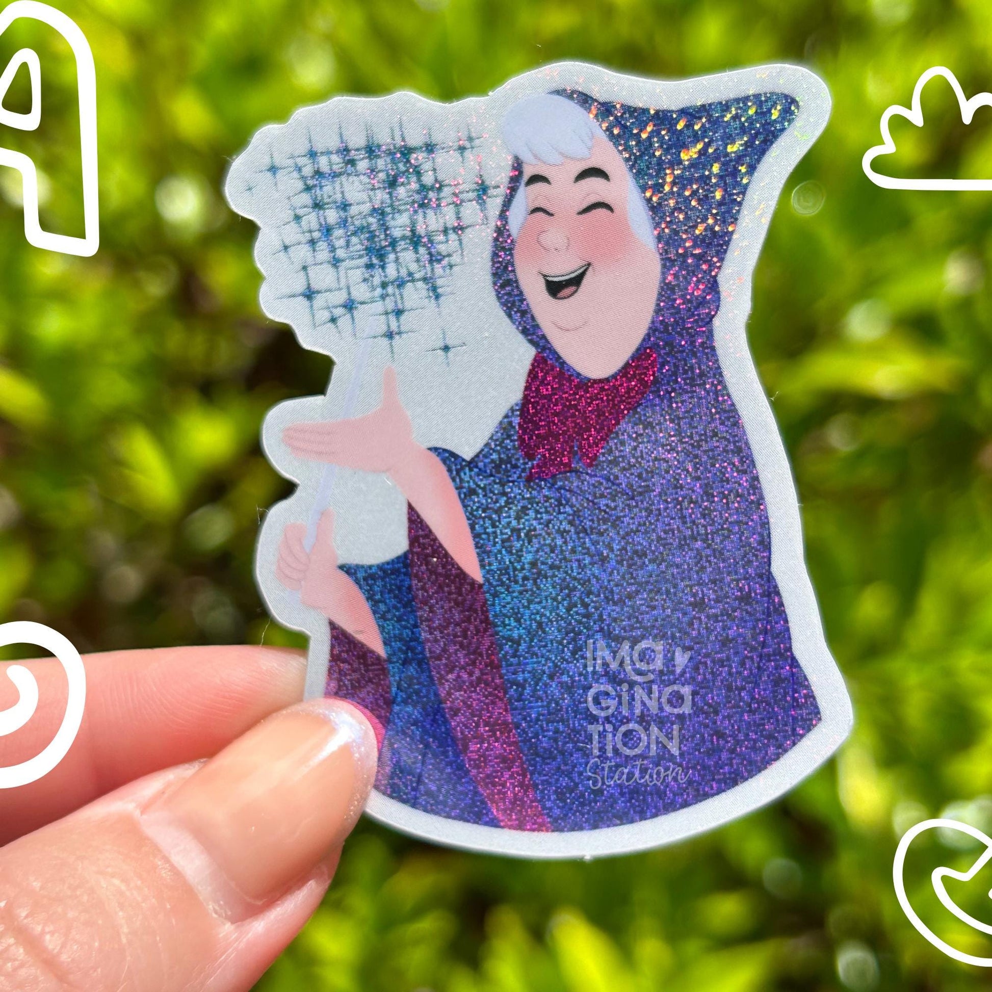 Sticker of a character with a fan held by a hand against a green leafy background