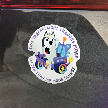 Car magnet with cartoon dog and text on a reflective surface
