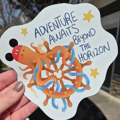 A close-up photo of a hand holding a custom die-cut magnet. The design features a cartoon octopus wearing Mickey Mouse ears tangled in a wooden ship's wheel with ropes. Includes the exact legible quote: "ADVENTURE AWAITS BEYOND THE HORIZON." Perfect for Disney cruise stateroom door decor.