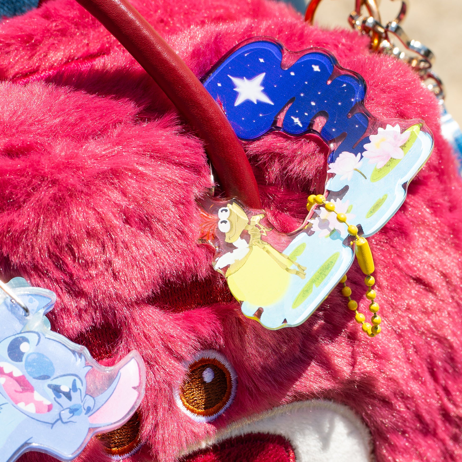Ray and Evangeline Princess and the Frog keychain size reference showing acrylic charm dimensions
