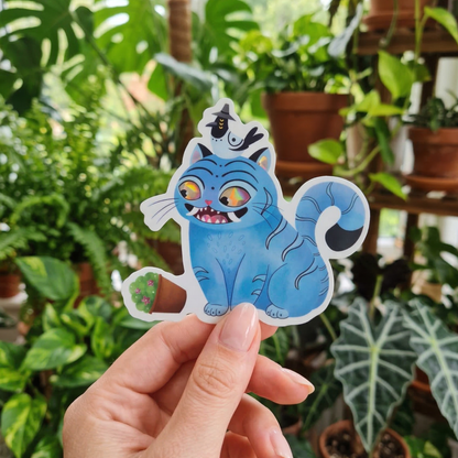 Derpy tiger sticker held by hand – prismatic rainbow kawaii cat waterproof vinyl