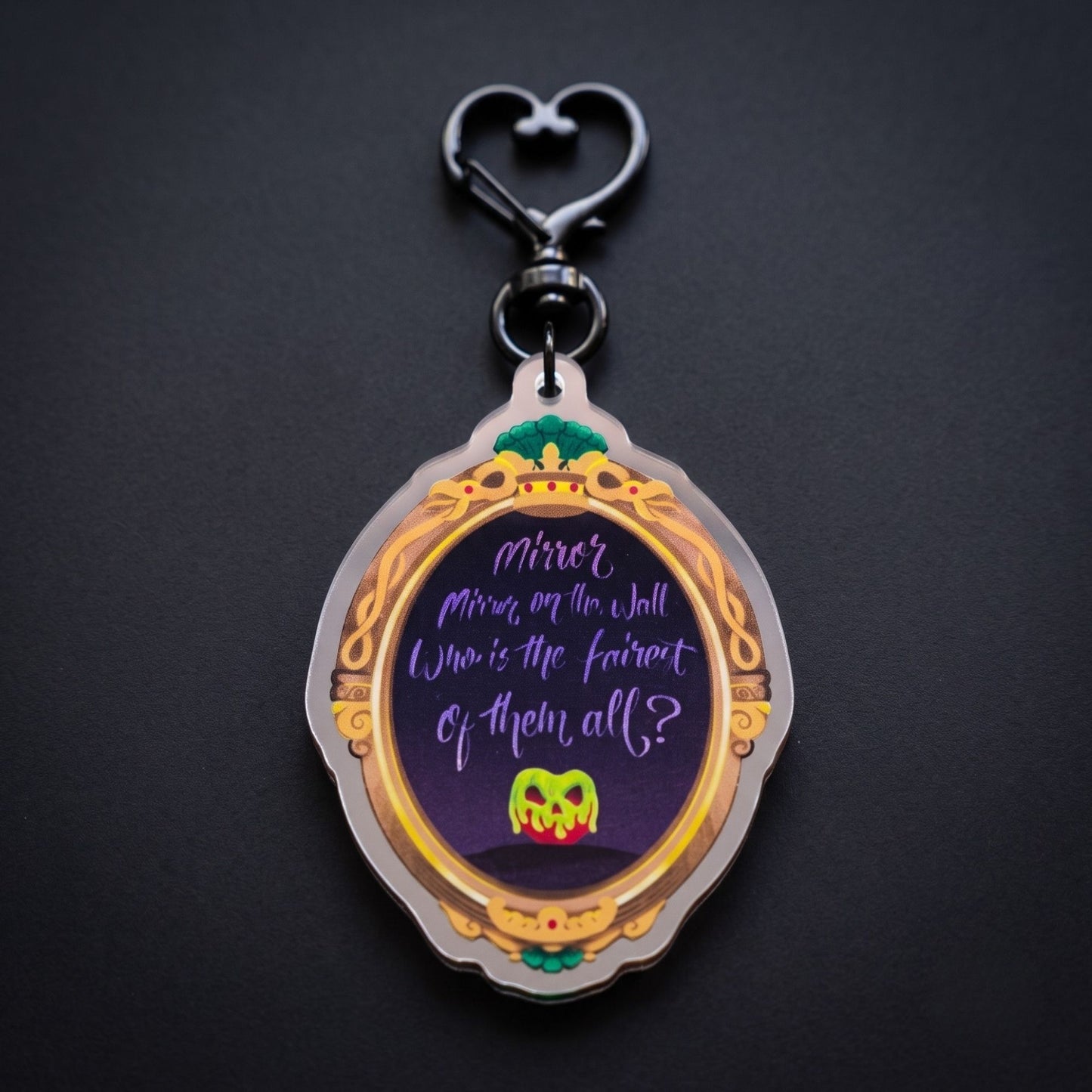 Wicked Queen mirror bag charm reflecting a hidden villain face in the mirror finish