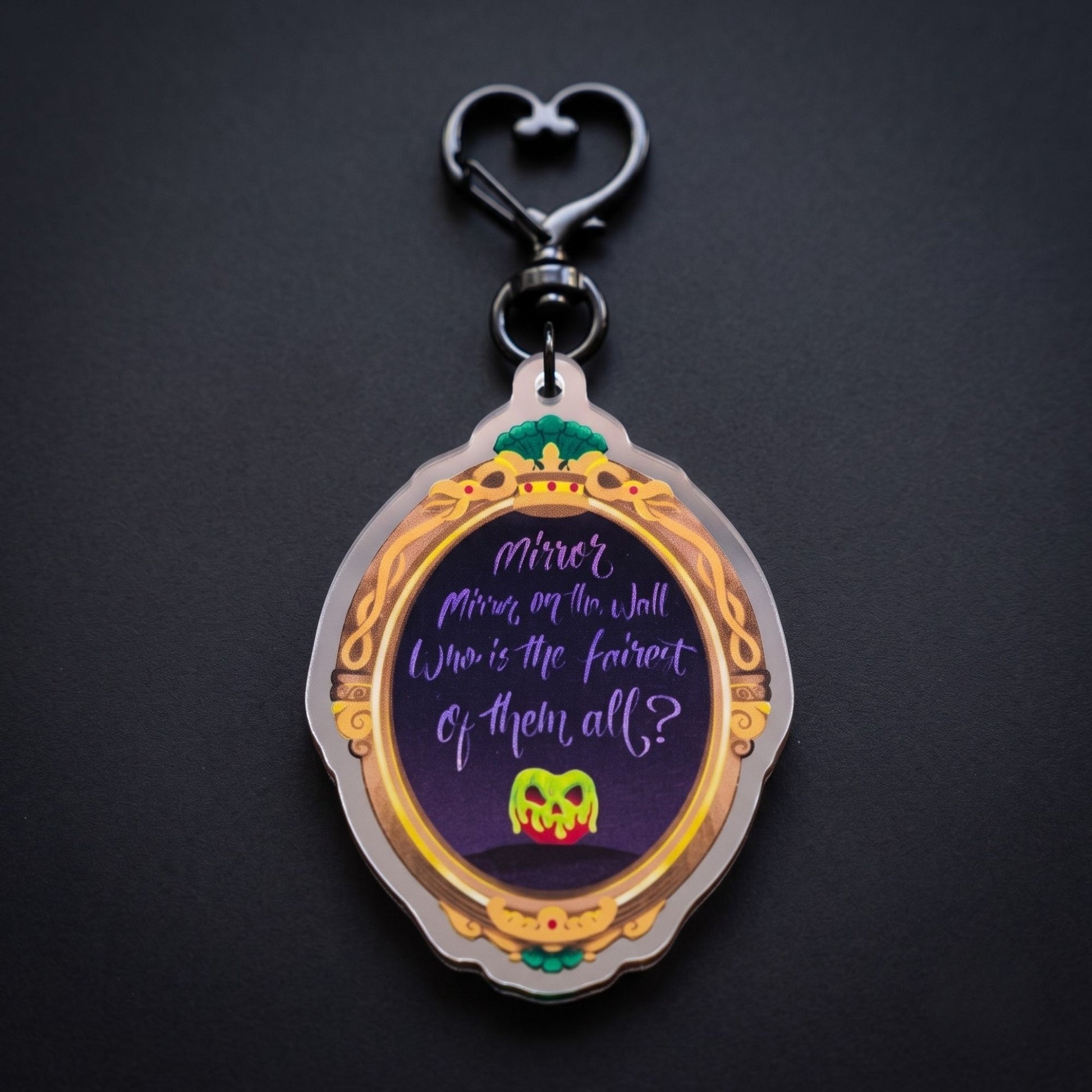 Wicked Queen mirror bag charm reflecting a hidden villain face in the mirror finish