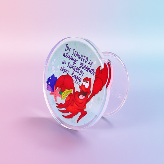 Phone holder with cartoon crab design and text on a purple background