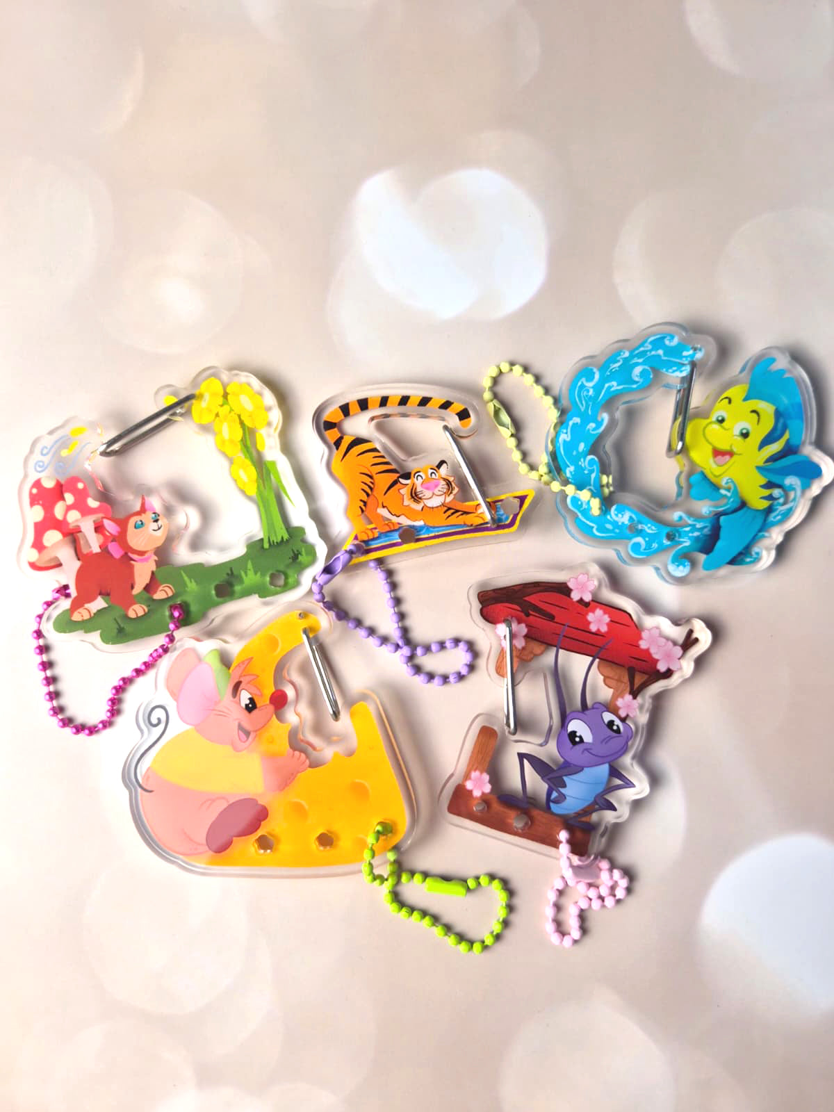 Colorful animal-themed keychains on a light background