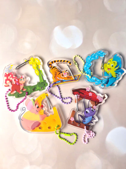 Colorful animal-themed keychains on a light background