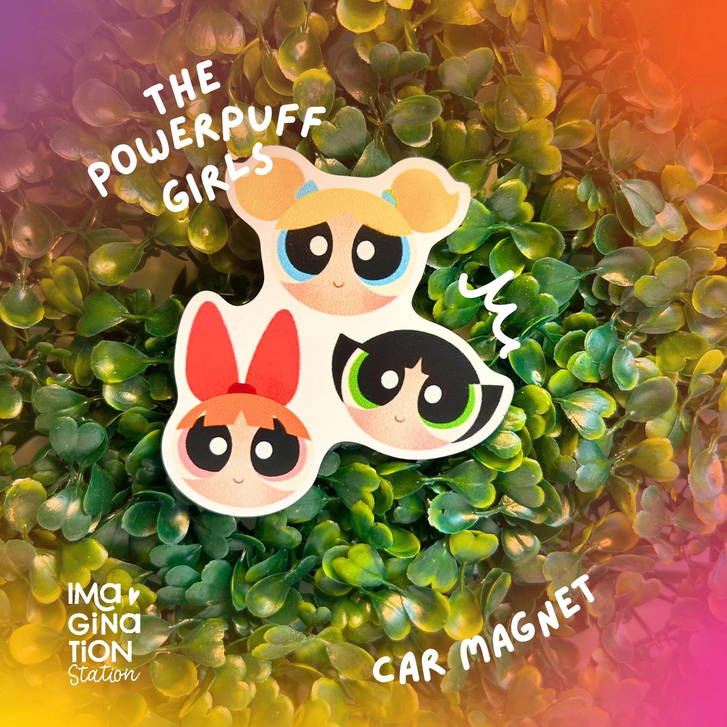 Powerpuff Girls car magnet on a green leafy background with colorful border