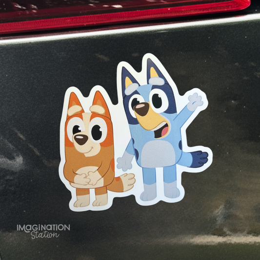 Bluey and bingo car magnet on a black surface with 'Imagination Station' branding.
