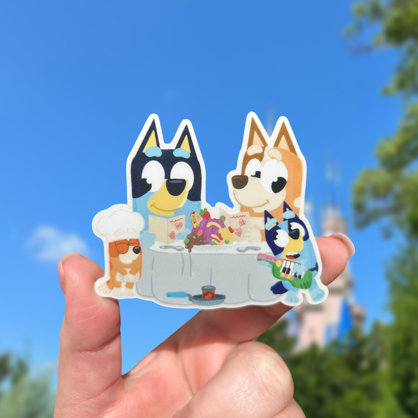 Bluey Family Heeler sticker held by hand – 3 x 2.5 inch clear glossy waterproof vinyl