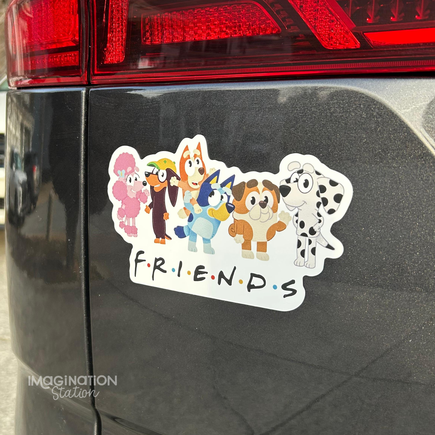 Cartoon character car magnet on a car tailgate with 'FRIENDS' text
