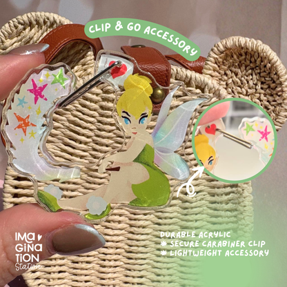 Butterfly-shaped clip with Tinker Bell design on a woven surface, labeled 'Clip & Go Accessory'.