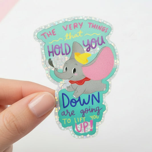 Dumbo sticker with motivational quote on a colorful background