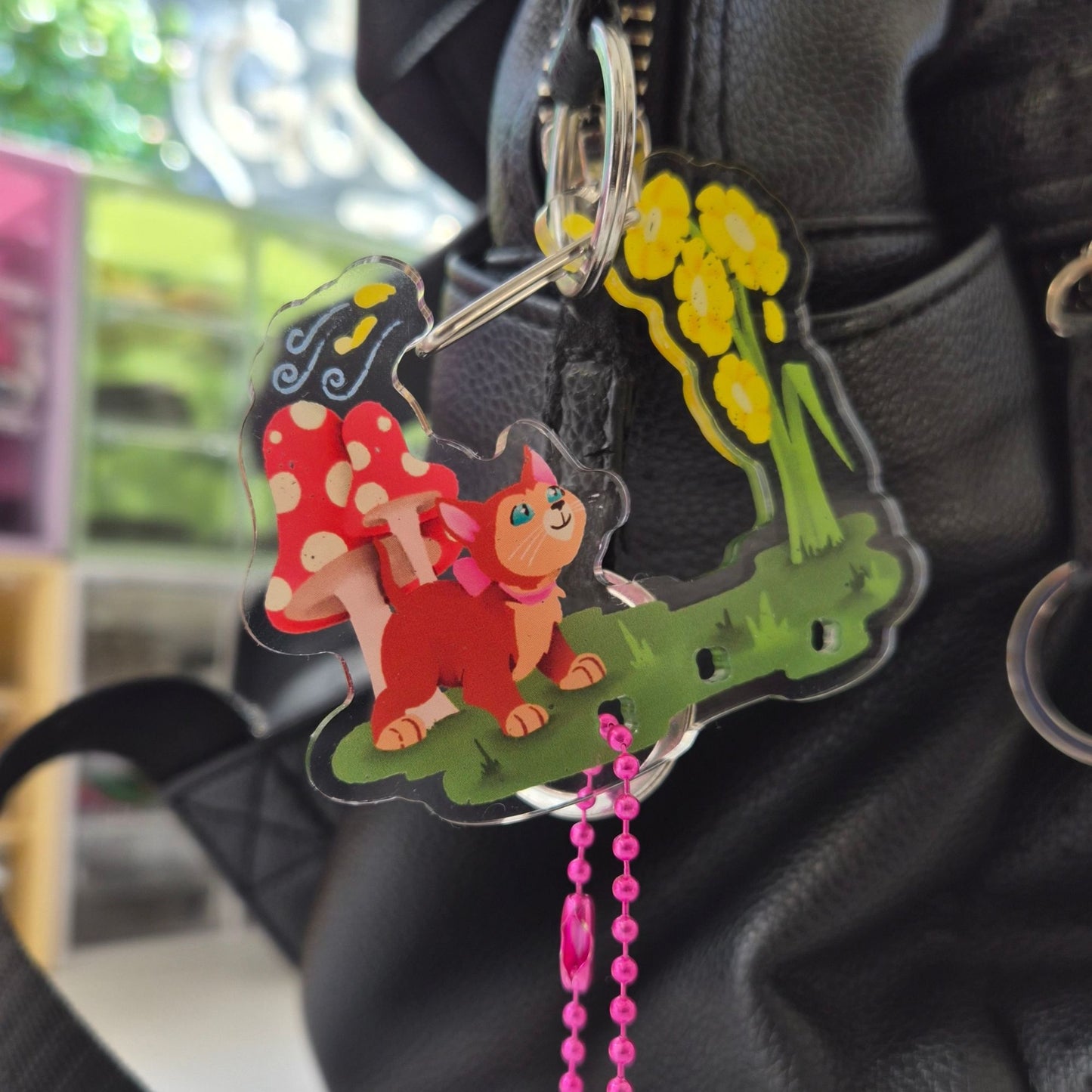 Alice in Wonderland Dinah keychain clipped to bag – cute cat Disney carabiner charm
