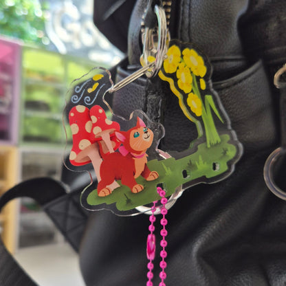 Alice in Wonderland Dinah keychain clipped to bag – cute cat Disney carabiner charm