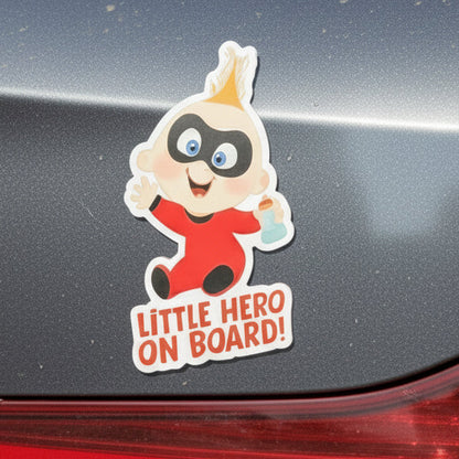 Car magnet with baby superhero character and 'Little Hero on Board!' text on a colorful background