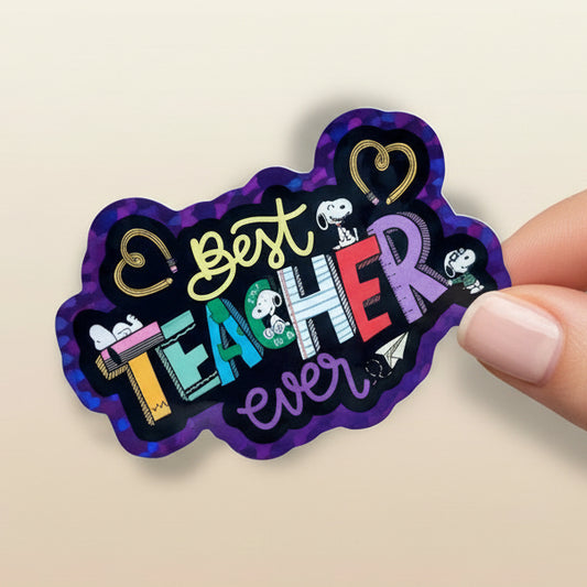 Sticker with 'Best Teacher Ever' text and Snoopy design on a blurred classroom background