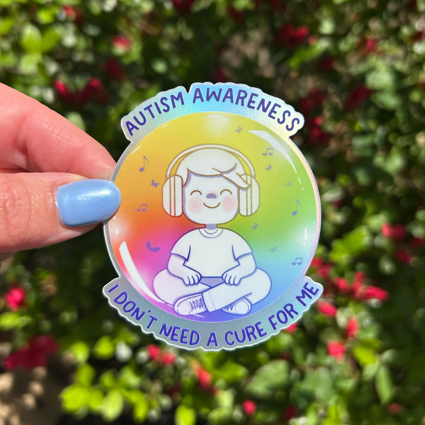 Autism Awareness holographic sticker held by hand – neurodivergent pride waterproof vinyl decal