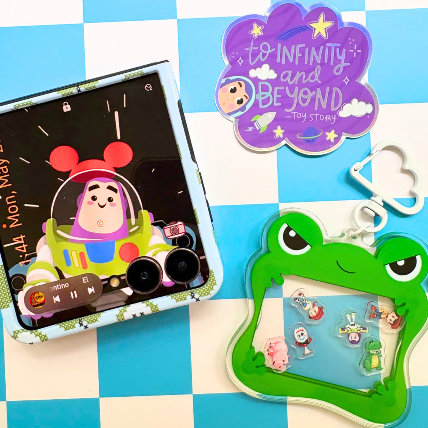 Lilypad Toy Story 5 keychain on bag lifestyle shot clipped to backpack strap