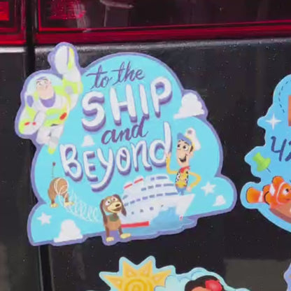 A collection of nine custom Disney magnets—including Toy Story, Nemo, Moana, Frozen, and more—arranged neatly on a polished black cruise cabin door.