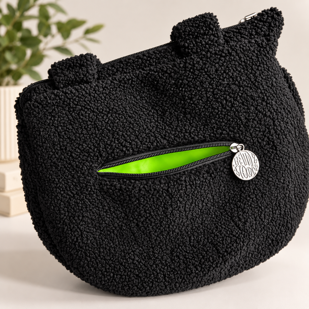 Cauldron crossbody bag interior view showing lining and pocket